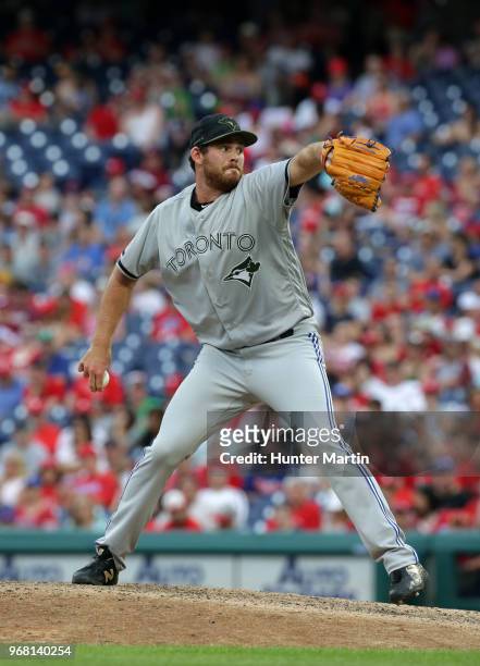 Joe Biagini of the Toronto Blue Jays throws a pitch in the eighth inning during a game against the Philadelphia Phillies at Citizens Bank Park on May...
