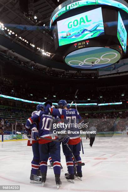 Marian Gaborik of Slovakia celebrates his second period goal with his teammates against the Czech Republic during the ice hockey men's preliminary...