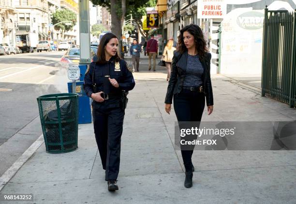 Melissa Fumero and Stephanie Beatriz in the "Gray Star Mutual" episode of BROOKLYN NINE-NINE airing Sunday, April 22 on FOX.