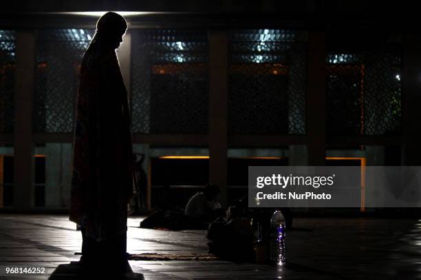 Muslims took a praying and resting during I'tikaf while they waiting for Qiyamul Lail for hunt the Lailatul Qadar in Istiqlal mosque, Jakarta,...