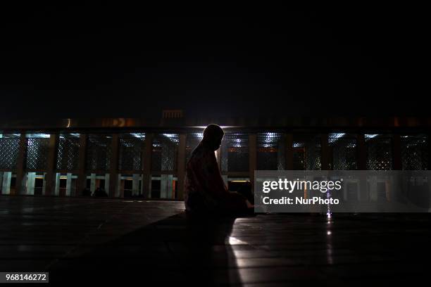 Muslims took a praying and resting during I'tikaf while they waiting for Qiyamul Lail for hunt the Lailatul Qadar in Istiqlal mosque, Jakarta,...