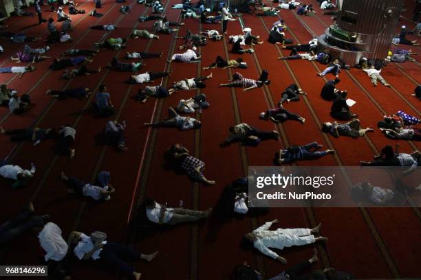 Muslims took a praying and resting during I'tikaf while they waiting for Qiyamul Lail for hunt the Lailatul Qadar in Istiqlal mosque, Jakarta,...