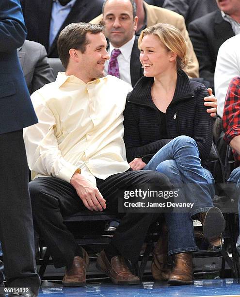 Julia Stiles and a guest attend the Chicago Bulls vs New York Knicks game at Madison Square Garden on February 17, 2010 in New York City.