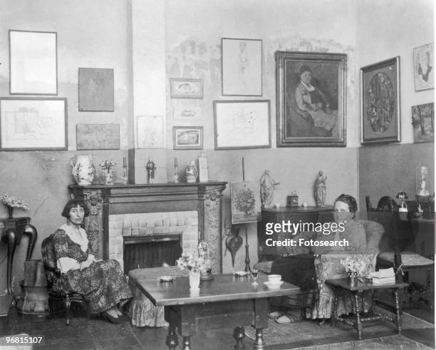 Gertrude Stein and Alice B Toklas sitting looking at camera, circa 1940s. .
