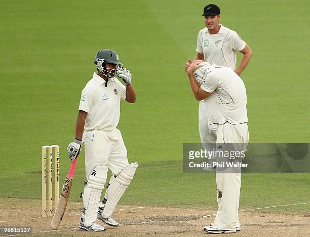 Daniel Vettori of New Zealand pulls his shirt over his head after Darryl Tuffey of New Zealand took a catch to dismiss Tamim Iqbal Khan of Bangladesh...