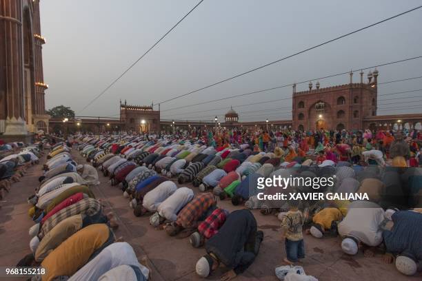 In this picture taken on June 5 Indian Muslims offer prayers after breaking their fast during the Holy month of Ramadan at Jama Masjid in New Delhi....