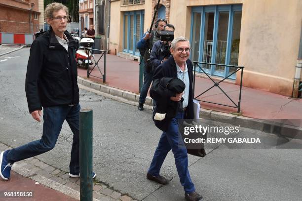 Gilles Bertin , who took part in the robbery of a Brink's storage in April 1988 in Toulouse, and his lawyer Christian Etelin, walk towards the...