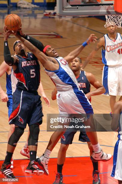 Josh Smith of the Atlanta Hawks and Craig Smith of the Los Angeles Clippers battle for a loose ball during their game at Staples Center on February...