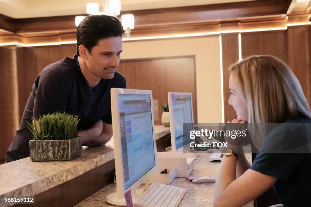 Guest star Warren Christie and Emily VanCamp in the "Haunted" episode of THE RESIDENT airing Monday, April 16 on FOX.