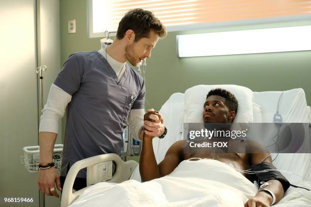 Matt Czuchry and guest star Patrick Walker in the "Total Eclipse of the Heart" season finale episode of THE RESIDENT airing Monday, May 14 on FOX.