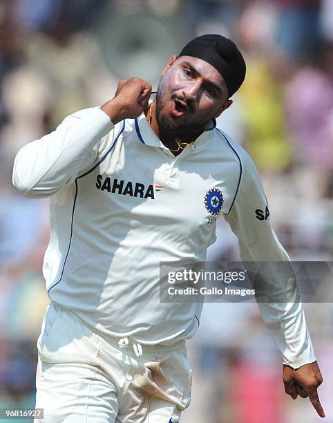 Harbhajan Singh of India celebrates the wicket of JP Duminy of South Africa for 6 runs during day five of the Second Test match between India and...