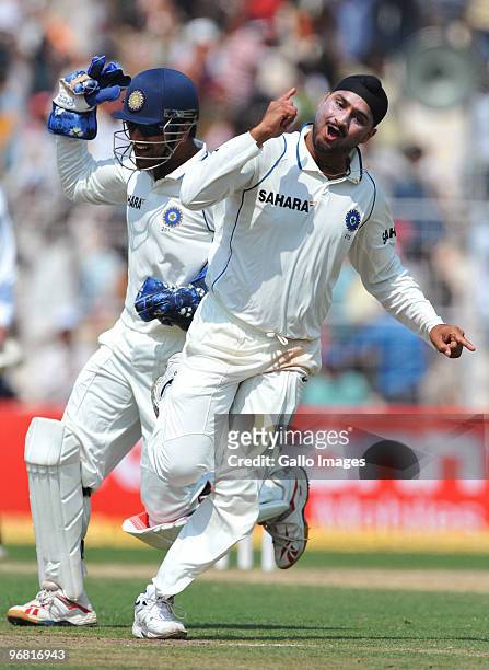 Harbhajan Singh of India celebrates the wicket of JP Duminy of South Africa for 6 runs during day five of the Second Test match between India and...