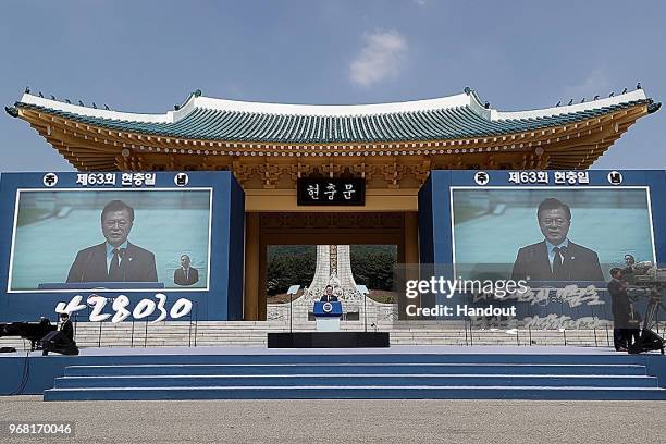 In this handout image provided by the South Korean Presidential Blue House, South Korean President Moon Jae-in speaks during a ceremony marking...