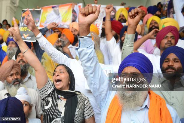 Indian Sikh radical activists shout pro-Khalistan slogans on the occasion of 34th anniversary of Operation Blue Star at the Golden temple in Amritsar...