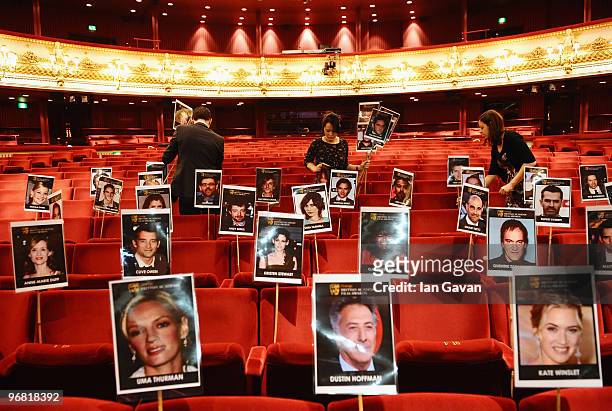 Royal Opera House staff prepare celebrity seating arrangements in preparation for the BAFTA ceremony at the Royal Opera House on February 18, 2010 in...