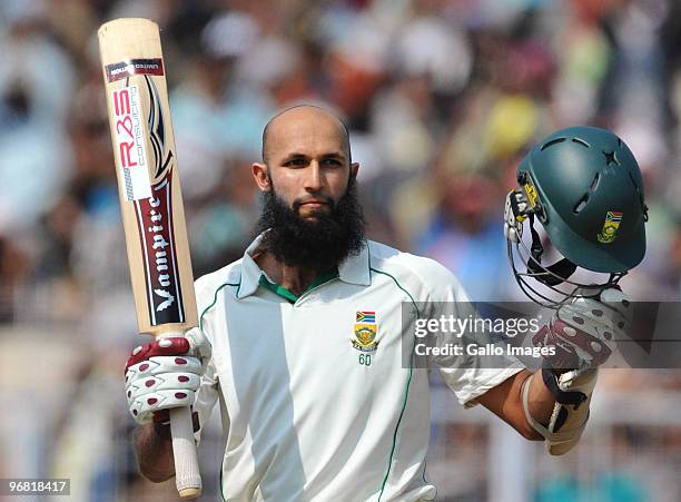 Hashim Amla of South Africa celebrates his century during day five of the Second Test match between India and South Africa at Eden Gardens on...
