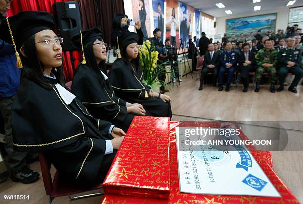 South Korean students of Taesungdong Elementary School participate in a graduation ceremony at Taesungdong freedom village near the border village of...