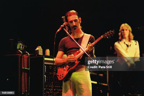 Frank Zappa with band member Eddie Jobson performing on stage at The Playhouse Theatre on February 14th, 1977 in Edinburgh, Scotland.