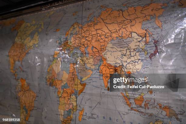 world map at plokštinė missile base, lithuania. - cold war stock pictures, royalty-free photos & images