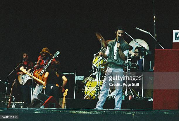 Frank Zappa performs on stage with band members Denny Walley, Ike Willis, Arthur Barrow and drummer Vinnie Colaiuta at The Knebworth Festival on...