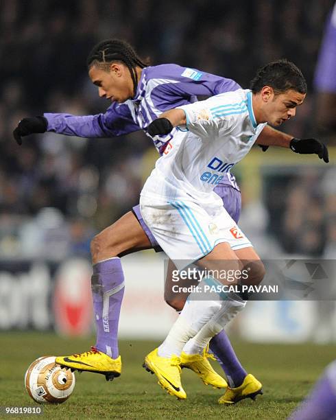 Toulouse's midfielder Etienne Capoue vies with Marseille's forward Hatem Ben Arfa during the French league cup football match Toulouse vs Marseille...