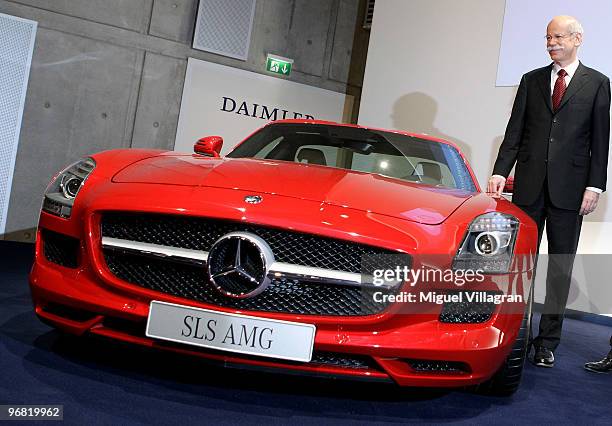 Dieter Zetsche, CEO of Daimler AG, poses next to a SLS AMG car during the company's annual press conference on February 18, 2010 in Stuttgart,...