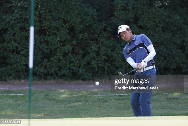 Phachara Khongwatmai of Thailand chips onto the 10th green during the Pro-Am of The 2018 Shot Clock Masters at Diamond Country Club on June 6, 2018...