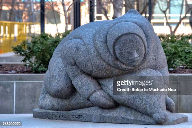 Hunter with Seal' sculpture in Canadian black granite. The authors are Paulosie Kanayook and Louise Temporale. The urban art can be seen in Bay...