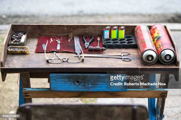 The working stand of a lighter re-filler. Due to economic hardship, Cuban people do not discard their lighters, instead, they take it for re-filling...