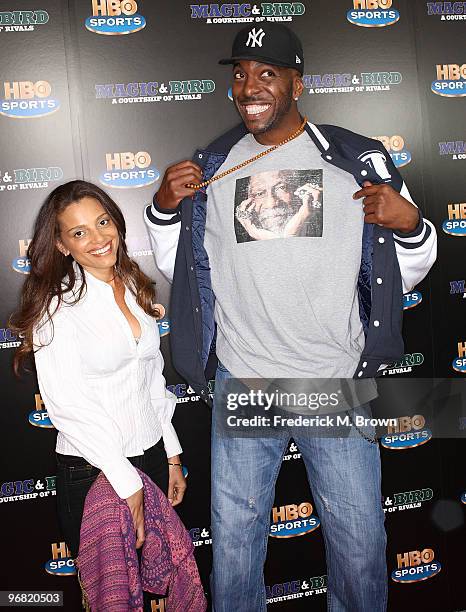 Former basketball player John Salley and his guest attend the "Magic & Bird: A Courtship of Rivals" film premiere at the Mann Bruin Theatre on...