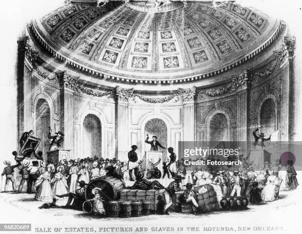 An engraving of enslaved people being sold with other Property in New Orleans in the rotunda of St Charles Hotel circa 1839. With text 'Sale of...