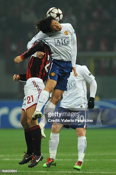 Andrea Pirlo of AC Milan clashes with Ji-sung Park of Manchester United during the UEFA Champions League round of 16 first leg match between AC Milan...