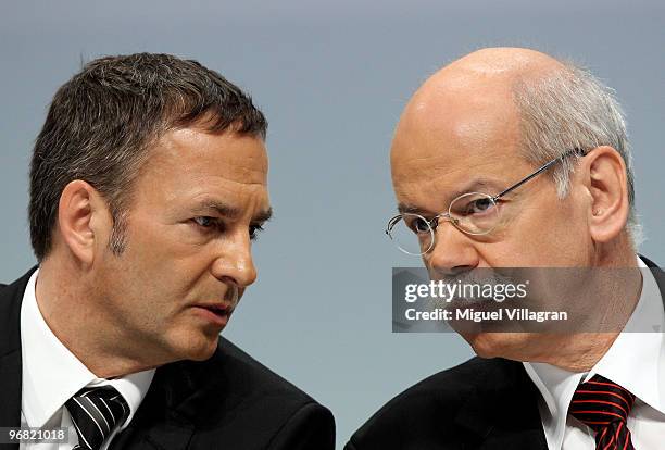 Bodo Uebber, the company's chief financial officer, and Dieter Zetsche, CEO of Daimler AG, address the media during the company's annual press...