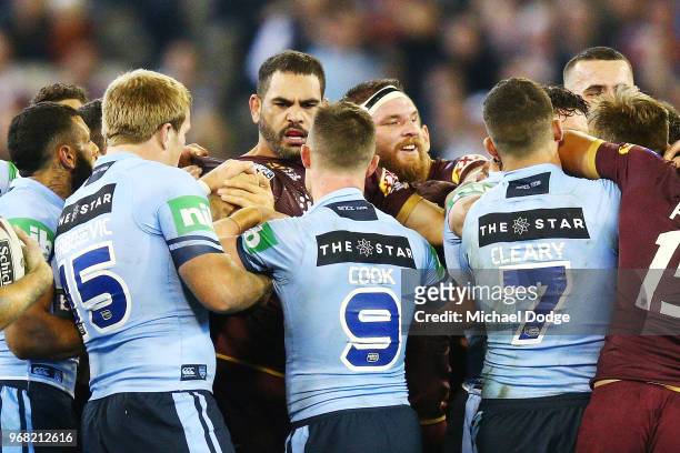 Melee breaks out after Greg Inglis of the Maroons tackled Tom Trbojevic of the Blues during game one of the State Of Origin series between the...