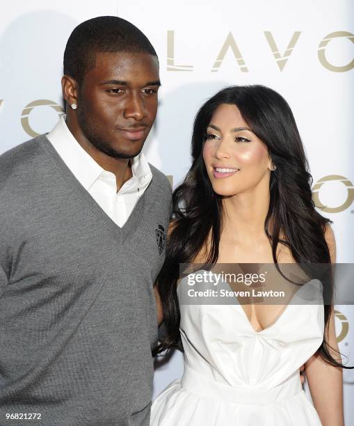 Pro football player Reggie Bush and television personality Kim Kardashian arrive for "Queen Of Hearts" ball at Lavo Restaurant & Nightclub at The...