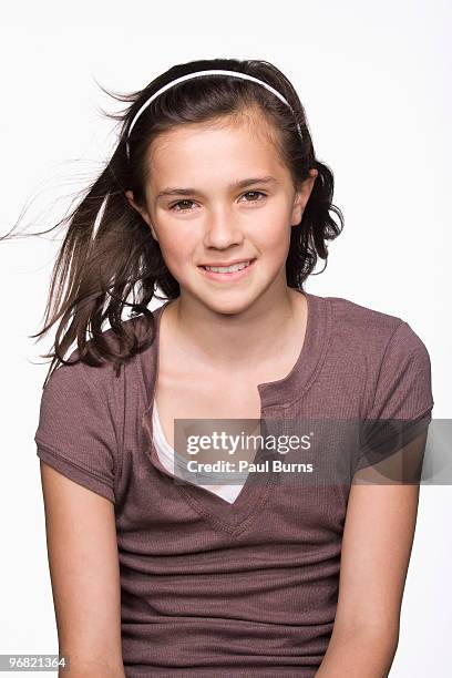 girl smiling and hair flying in the air - haarreif stock-fotos und bilder