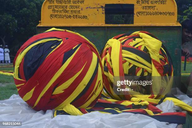 This photograph taken on June 5 shows a large German flag pictured prior to display at a field in Magura. - A farmer in Bangladesh has unfurled a...