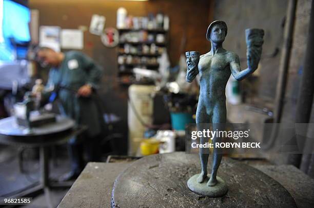 Artisan Joaquin Quintero works on an "Actor" statuette at the American Fine Arts Foundry in Burbank, California, January 19, 2010. The statuettes...