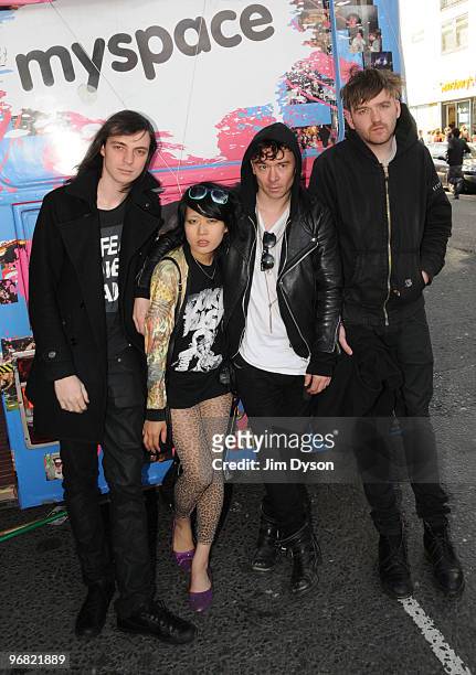 Leopold Ross, Akiko Matsuura, Robbie Furze and Milo Cordell of The Big Pink pose beside the MySpace bus during the Camden Crawl festival in Camden...