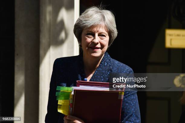 British Prime Minister Theresa May leaves 10 Downing Street as she makes her way to the Parliament to attend Prime Minister Question session , London...