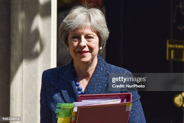 British Prime Minister Theresa May leaves 10 Downing Street as she makes her way to the Parliament to attend Prime Minister Question session , London...