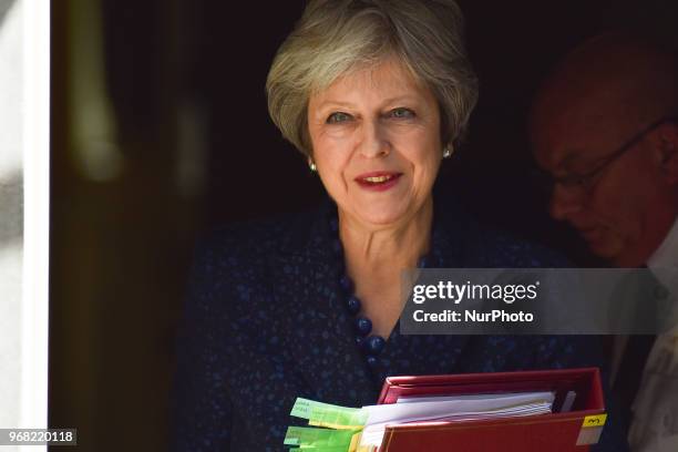 British Prime Minister Theresa May leaves 10 Downing Street as she makes her way to the Parliament to attend Prime Minister Question session , London...