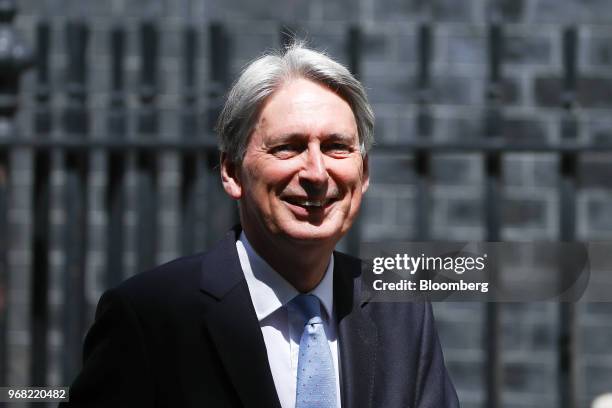 Philip Hammond, U.K. Chancellor of the exchequer, departs number 11 Downing Street to attend a weekly questions and answers session in Parliament in...