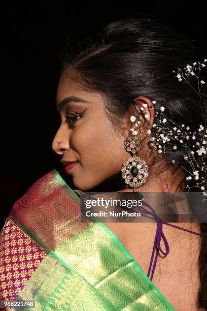 Indian model wearing an elegant and ornate Kanchipuram saree during a South Asian bridal fashion show held in Scarborough, Ontario, Canada.