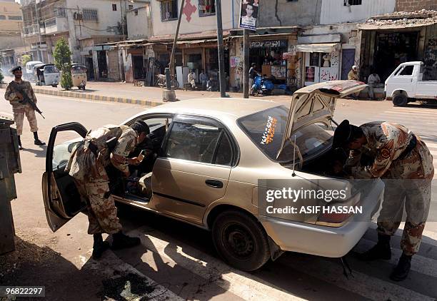 Pakistani paramilitary soldiers search a vehicle on a street in Karachi on February 18, 2010. The arrest of top Taliban commander Mullah Abdul Ghani...