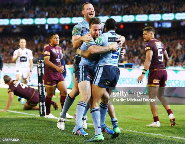 Boyd Cordner of the Blues and James Maloney celebrate after Josh Addo-Carr of the Blues scores a try during game one of the State Of Origin series...