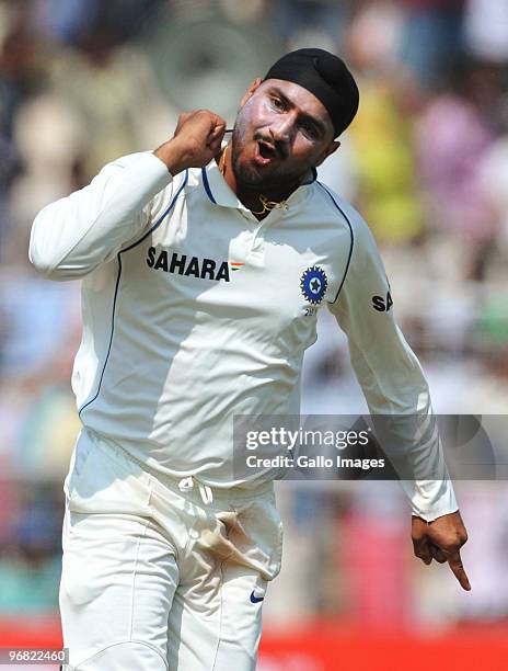 Harbhajan Singh of India celebrates the wicket of JP Duminy of South Africa for 6 runs during day five of the Second Test match between India and...