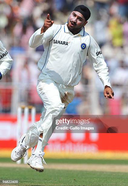 Harbhajan Singh of India celebrates the wicket of JP Duminy of South Africa for 6 runs during day five of the Second Test match between India and...