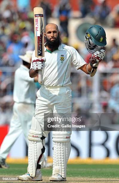 Hashim Amla of South Africa celebrates his century during day five of the Second Test match between India and South Africa at Eden Gardens on...