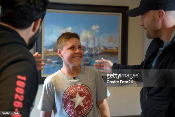 Jacaranda FM DJ Martin Bester, 14-year-old Leo Sadler with his role model AB de Villiers at his home during an arranged surprise meeting on June 05,...